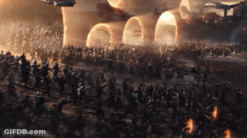 A Large Group Of People Are Standing In A Field With The Words Tannerfrizzell On The Bottom Right GIF