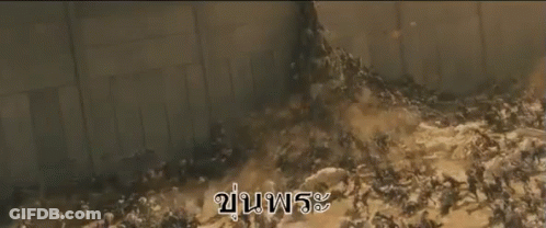 A Large Group Of People Are Walking Through A Flooded Area With The Words " Tsunami " Written On The Bottom GIF