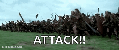 A Large Group Of Soldiers Are Marching In A Field With The Words `` Attack '' Written On The Bottom . GIF