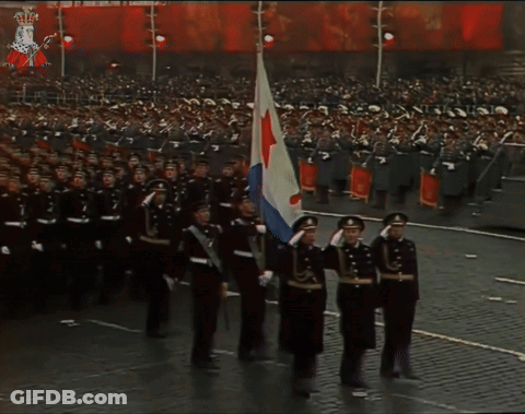 A Large Group Of Soldiers Marching In A Parade With The Number 7 On The Back GIF