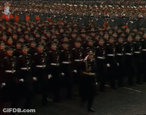 A Large Group Of Soldiers Marching With The Number 7 On Their Shirts GIF