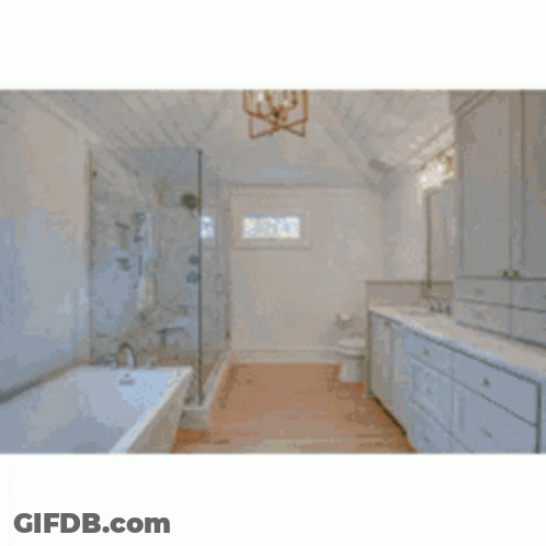 A Large House With A Lush Green Lawn And A Brick Walkway Leading To It . GIF