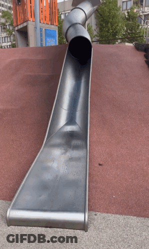 A Large Metal Slide Is Going Down A Red Carpet GIF