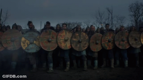 A Large Pile Of Logs Is Burning In A Field GIF