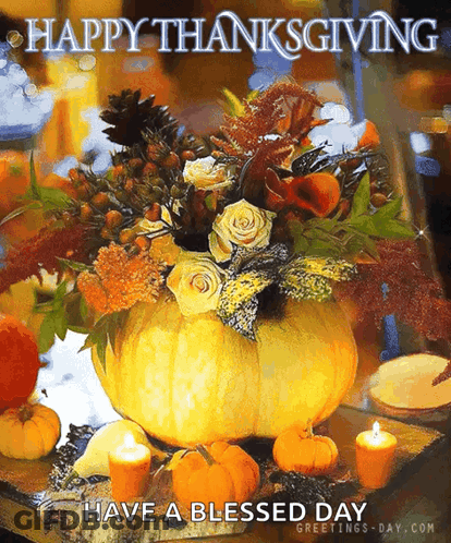 A Large Pumpkin Filled With Flowers And Candles On A Table With The Words Happy Thanksgiving Have A Blessed Day GIF