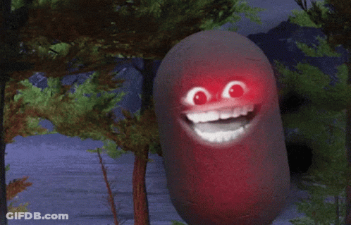 A Large Red Object In A Forest With Trees In The Background GIF