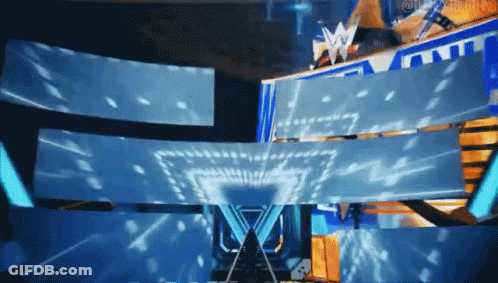 A Large Screen With The Letter W On It Is Projected On A Stage GIF