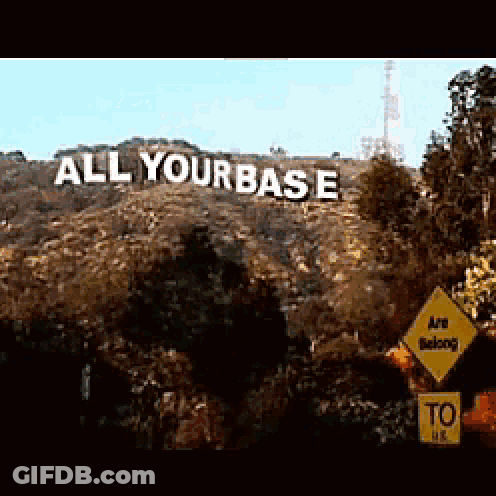Large Hill Sign Saying All Your Base GIF
