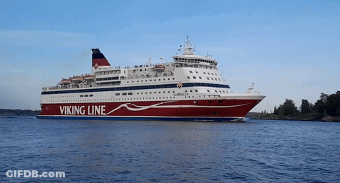 A Large Viking Line Cruise Ship Is Floating On The Water GIF