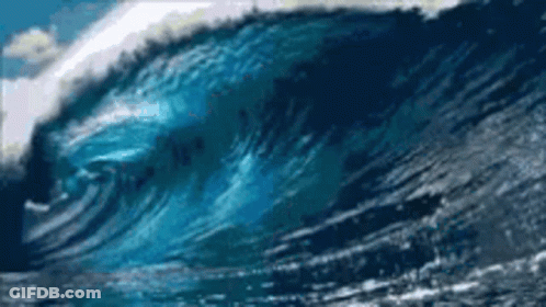 Large Wave Crashing On Beach Shore GIF
