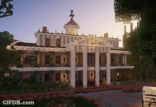 A Large White Building With A Clock Tower On Top Of It GIF