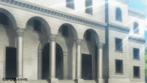 A Large White Building With Arches And Columns On The Side GIF