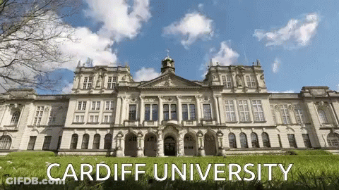A Large White Building With The Words Cardiff University Written On It GIF