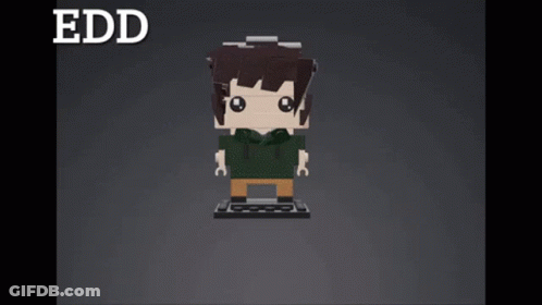 A Lego Block Of A Girl With Red Hair And A Purple Shirt GIF