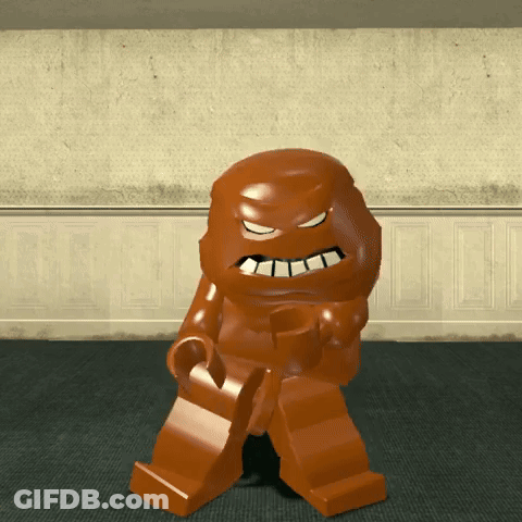 A Lego Figure Is Standing In A Room With A Wall Behind Him GIF