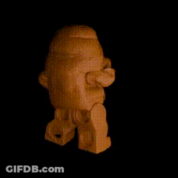 A Lego Figure Is Standing In The Dark GIF