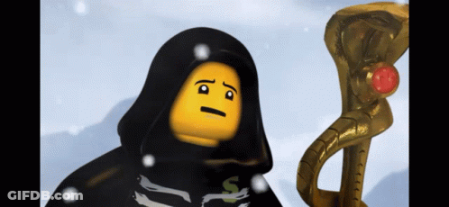 A Lego Figure With A Black Cape And A Yellow Face Is Standing Next To A Gold Snake GIF