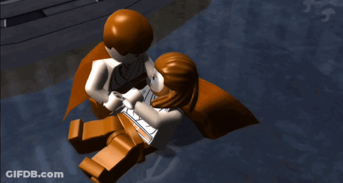 A Lego Figure With A Cross On His Face Is Laying On The Ground GIF