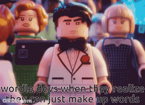 A Lego Man In A Tuxedo And Bow Tie Stands In Front Of A Crowd GIF