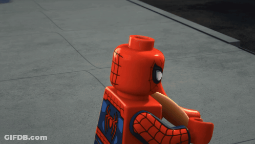 A Lego Spider-Man Holding A Hot Dog With Yellow Lines Around His Head GIF