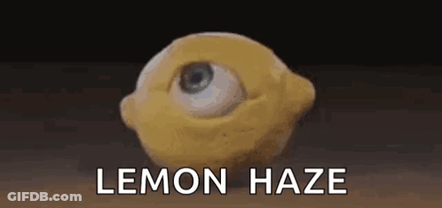 A Lemon With An Eye On It And The Words `` Lemon Haze '' Written Below It . GIF