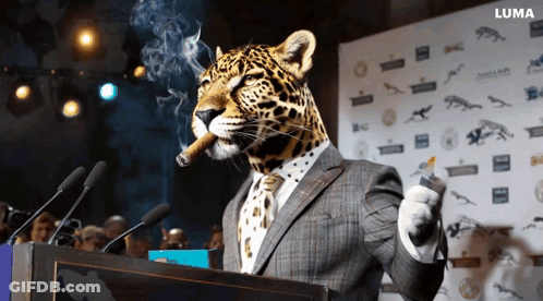 A Leopard In A Suit Smoking A Cigar And Giving A Speech GIF