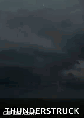 A Lightning Bolt Is Hitting The Ground In The Middle Of A Field With The Words Thunderstruck Below It . GIF