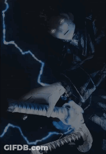 A Lightning Bolt Strikes A Statue Of A Snake GIF