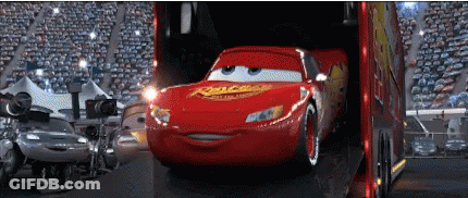 A Lightning Mcqueen From Cars Is Being Loaded Into A Trailer GIF