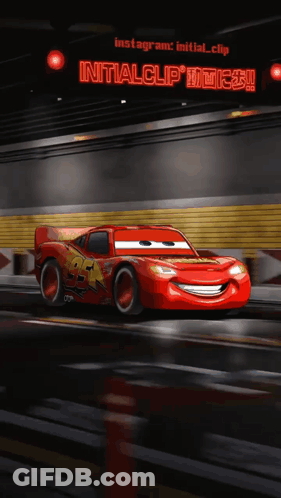 A Lightning Mcqueen From The Movie Cars Is Driving Down The Road GIF