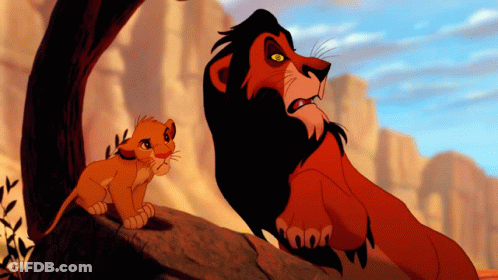 A Lion And A Cub From The Lion King Are Standing Next To Each Other GIF