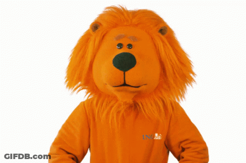 A Lion Mascot Is Wearing A Sweater That Says Ing On It GIF