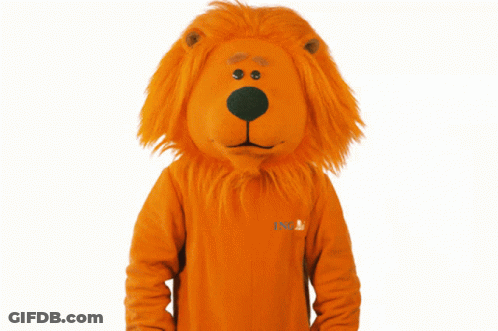 A Lion Mascot Is Wearing An Orange Ing Sweater GIF