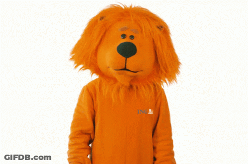 A Lion Mascot Wearing An Orange Sweater With Ing Written On It GIF