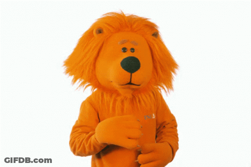 A Lion Mascot With A Shirt That Says ' Nl ' On It GIF