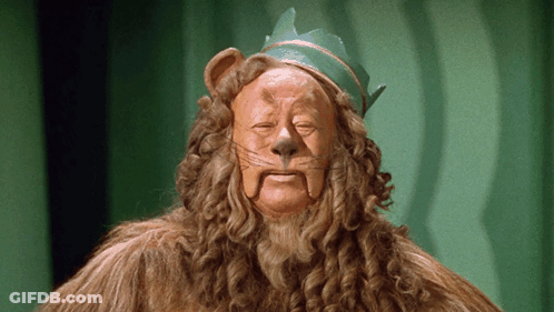 A Lion With A Green Crown On His Head GIF
