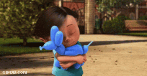 A Little Boy Holding A Blue Balloon Dog GIF