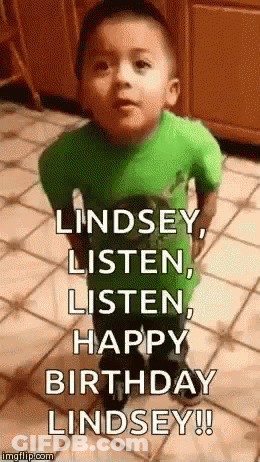 A Little Boy In A Green Shirt Is Standing On A Tiled Floor And Making A Funny Face . GIF