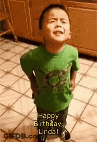 A Little Boy In A Green Shirt Is Standing On A Tiled Floor And Saying Happy Birthday Linda GIF