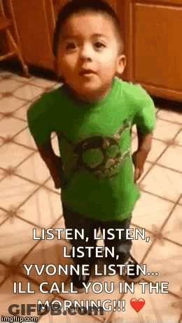 A Little Boy In A Green Shirt Is Standing On A Tiled Floor And Saying Listen , Listen , Listen . GIF