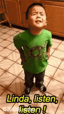 A Little Boy In A Green Shirt Is Standing On A Tiled Floor And Says Linda Listen Listen GIF