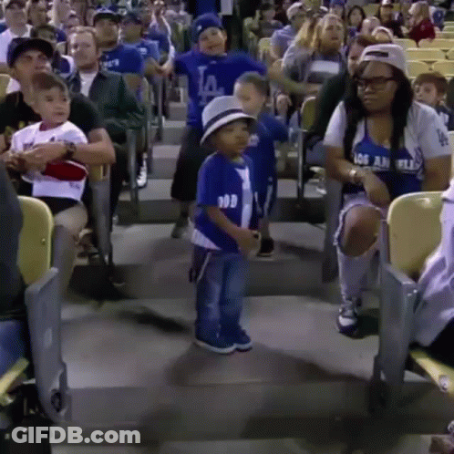 A Little Boy In A La Dodgers Shirt Is Dancing In The Stands GIF