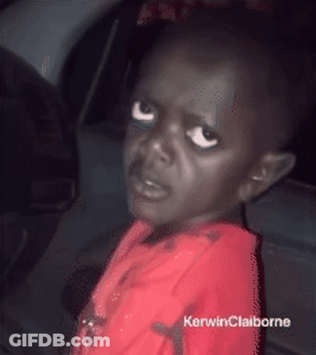 A Little Boy In A Red Shirt With Kerwinclaiborne Written On The Bottom Right GIF