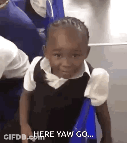A Little Boy In A School Uniform Is Sitting On A Blue Chair . GIF