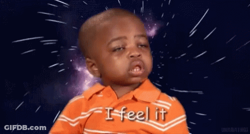 A Little Boy In An Orange Shirt Is Crying And Saying `` I Feel It '' In Front Of A Space Background . GIF