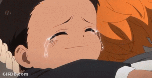 A Little Boy Is Crying While Being Hugged By A Person GIF
