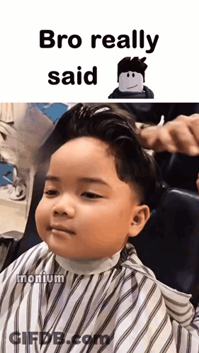 A Little Boy Is Getting His Hair Cut In A Barber Shop GIF