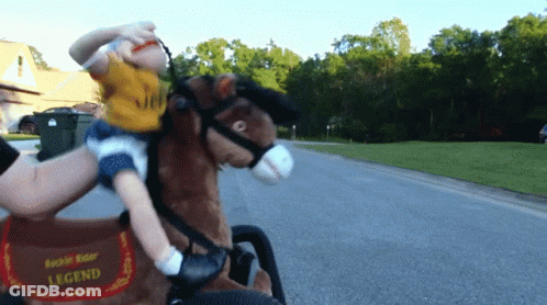 A Little Boy Is Riding A Rockin Rider Legend Toy Horse GIF