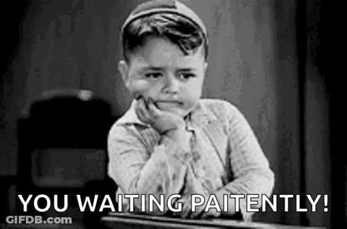 A Little Boy Is Sitting At A Desk With His Hand On His Chin And The Words `` You Waiting Patiently '' . GIF