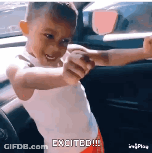 A Little Boy Is Sitting In A Car With His Arms Outstretched And The Words Excited Written Below Him . GIF